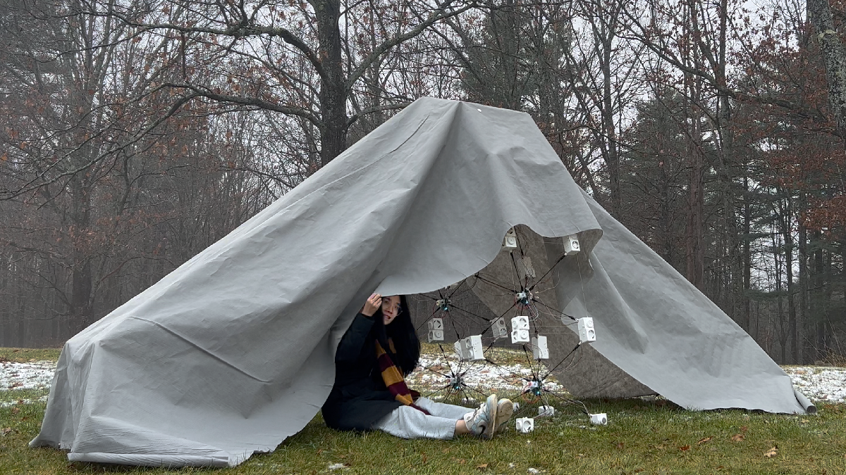Student under a tarp