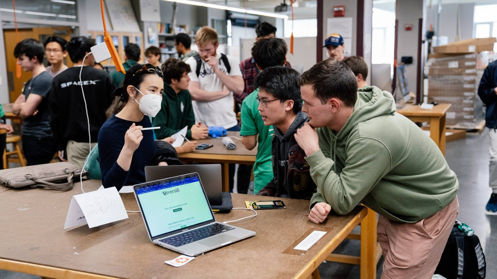 HackDartmouth participants with judge