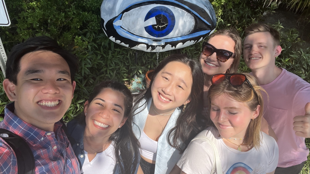 Group of students posing in front of the Dali eye