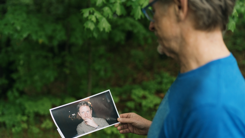 Andrew Campbell looks at photo of his late brother, Ed.