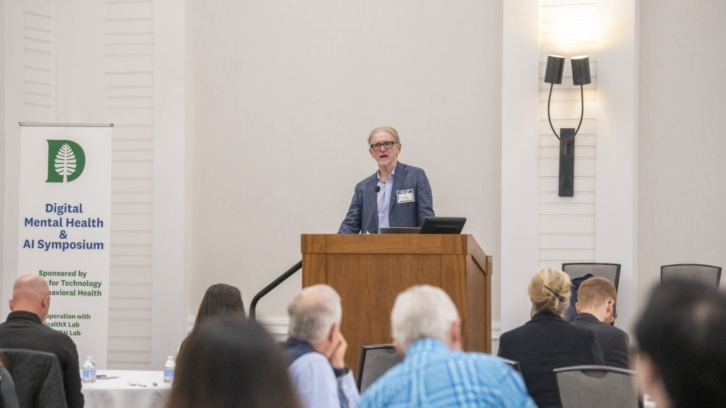 Professor Andrew Campbell speaks at the symposium